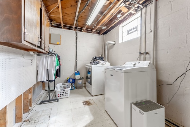 935 Broglie, South Park, PA 15236 - laundry area featuring light floors, cabinet space, washing machine and dryer, and concrete block wall