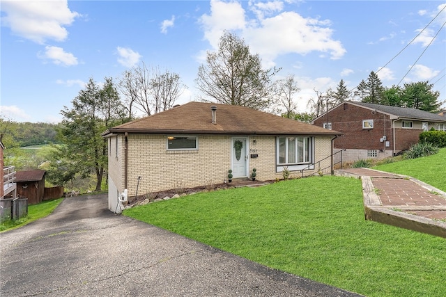 935 Broglie, South Park, PA 15236 - view of front facade featuring a front yard, aphalt driveway, and brick siding