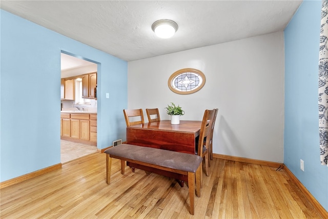 935 Broglie, South Park, PA 15236 - dining room featuring light wood-style floors, baseboards, and visible vents