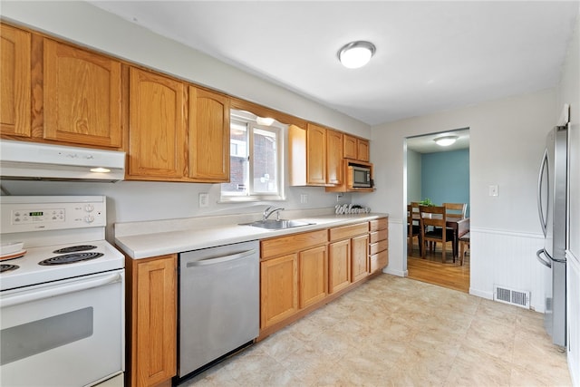 935 Broglie, South Park, PA 15236 - kitchen featuring a sink, light countertops, stainless steel appliances, under cabinet range hood, and visible vents
