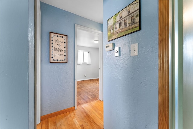 935 Broglie, South Park, PA 15236 - hallway featuring a textured wall, baseboards, and wood finished floors