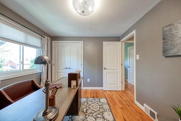 office featuring visible vents, baseboards, and light wood-type flooring