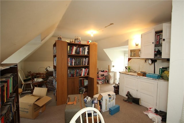 interior space with carpet and lofted ceiling