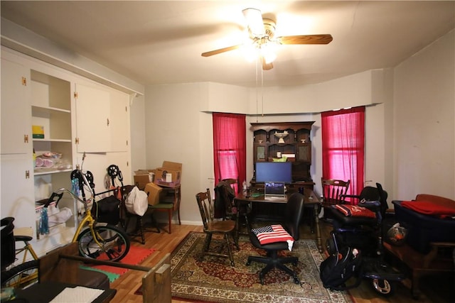 office space featuring ceiling fan and wood finished floors