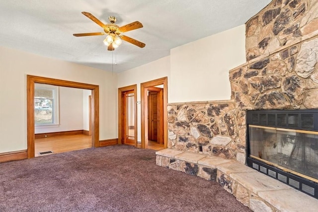 unfurnished living room with baseboards, ceiling fan, carpet flooring, and visible vents