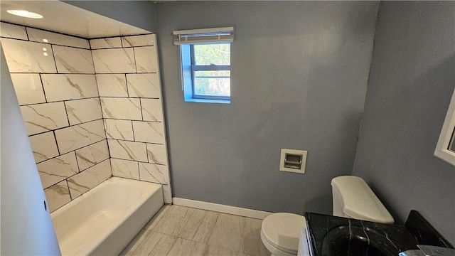 full bathroom with baseboards, shower / bathtub combination, vanity, and toilet