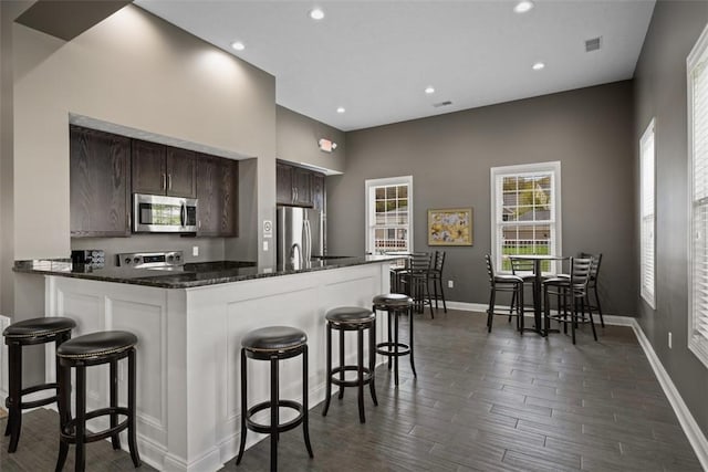 807 Stockton Rdg, Cranberry Twp, PA 16066 - kitchen featuring baseboards, recessed lighting, dark brown cabinetry, and stainless steel appliances