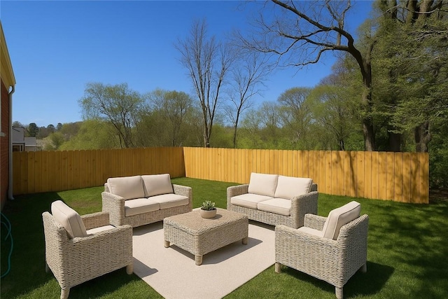 view of patio with a fenced backyard and outdoor lounge area