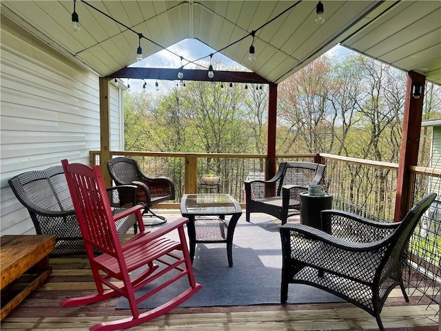 wooden terrace featuring outdoor lounge area