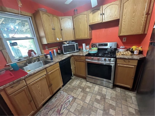 kitchen with pendant lighting, a sink, black appliances, brick patterned floor, and light brown cabinets