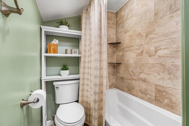 bathroom with shower / bath combo with shower curtain and toilet