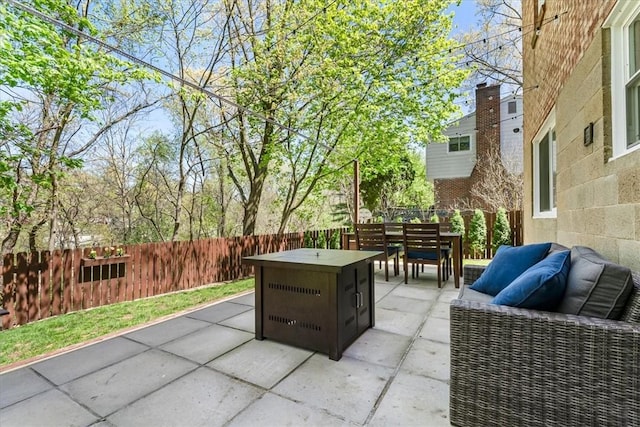 view of patio / terrace featuring outdoor dining space and fence private yard