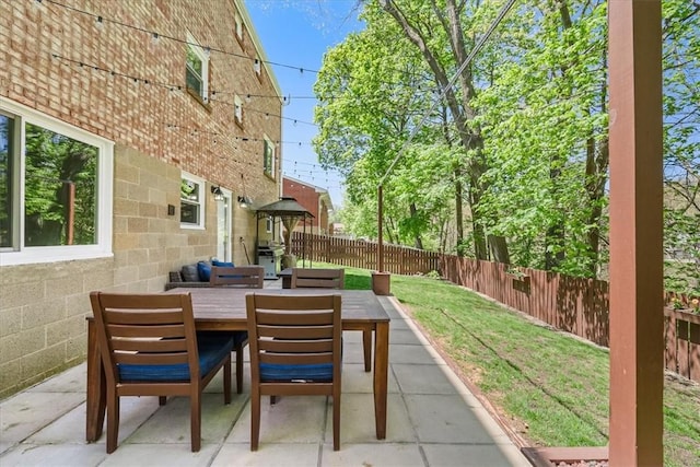 view of patio / terrace with a fenced backyard and outdoor dining area