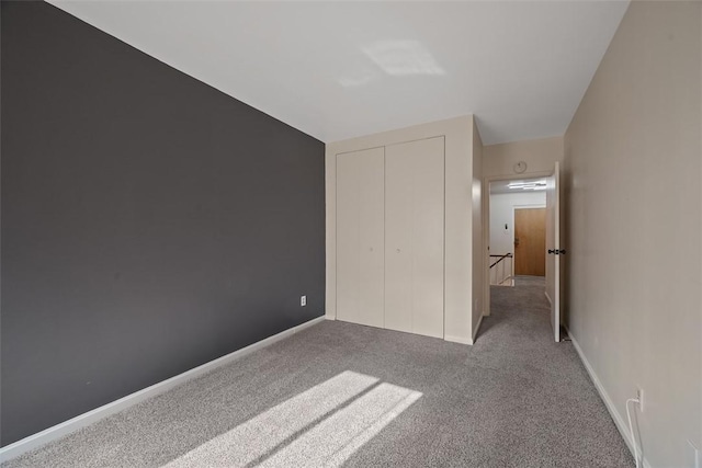 307 S Dithridge Unit 208, Oakland, PA 15213 - unfurnished bedroom featuring carpet flooring, a closet, and baseboards