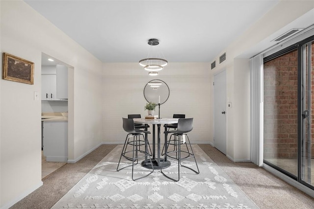 307 S Dithridge Unit 208, Oakland, PA 15213 - dining space featuring light colored carpet and baseboards