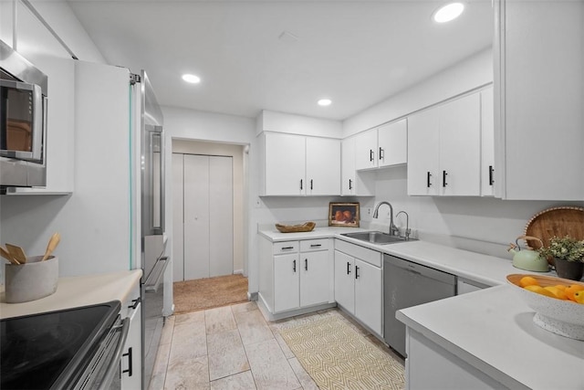 307 S Dithridge Unit 208, Oakland, PA 15213 - kitchen featuring a sink, stainless steel appliances, light countertops, white cabinets, and recessed lighting