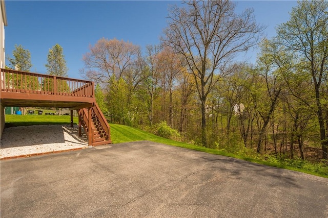 view of yard with stairway and a deck