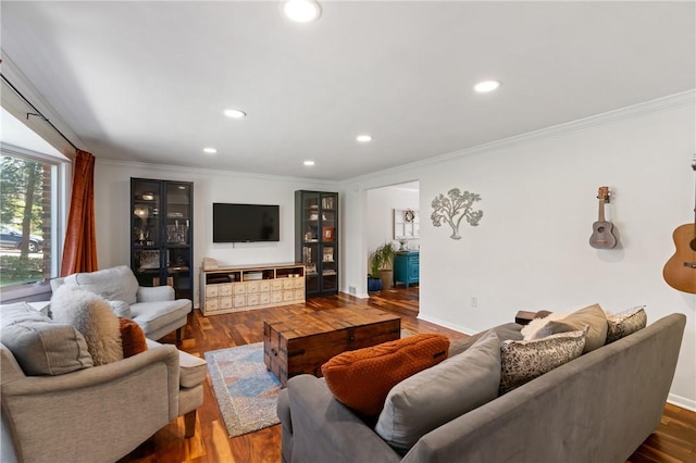 living room with recessed lighting, ornamental molding, and wood finished floors