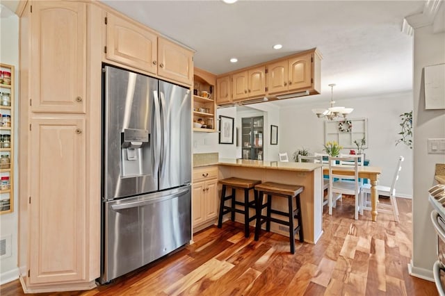 kitchen with open shelves, a peninsula, light brown cabinets, stainless steel appliances, and recessed lighting