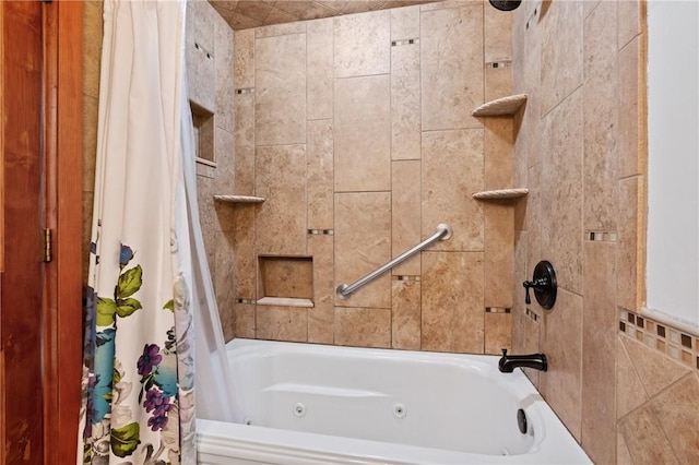bathroom with a combined bath / shower with jetted tub
