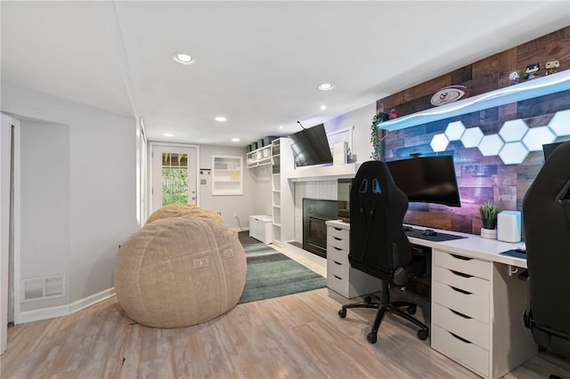 office with baseboards, recessed lighting, light wood-style flooring, and visible vents