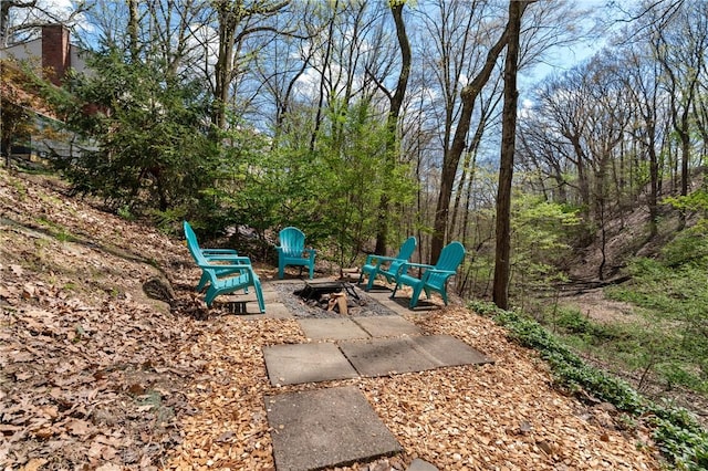 view of patio / terrace featuring a fire pit