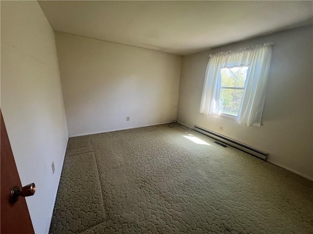 empty room featuring baseboards, a baseboard radiator, and carpet