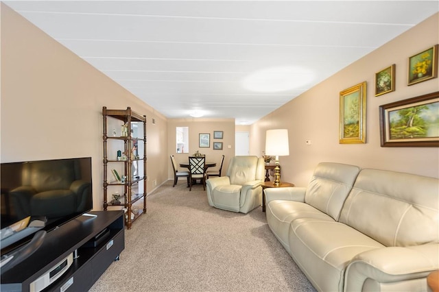 living area with light colored carpet