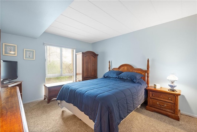 bedroom with carpet floors and baseboards
