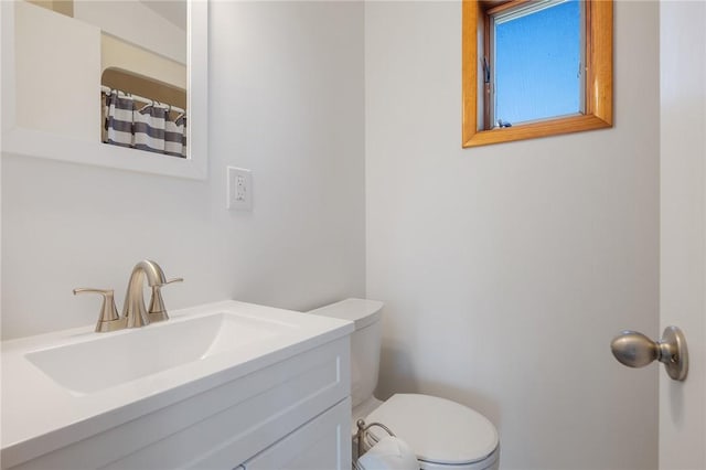 full bathroom featuring toilet and vanity