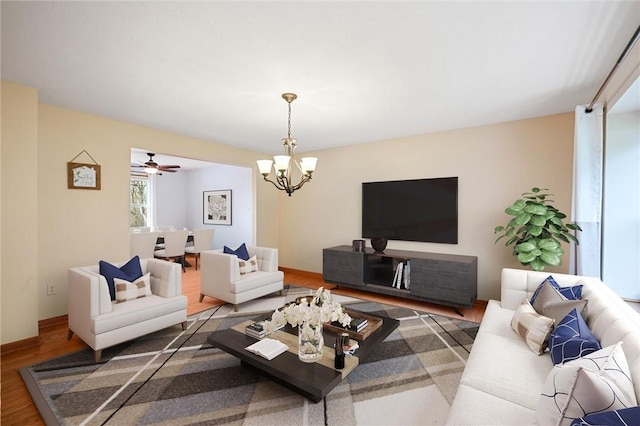 living room featuring a chandelier and wood finished floors