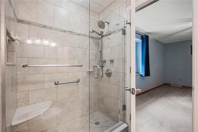 full bath featuring baseboards, visible vents, and a shower stall