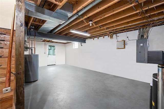 basement with electric panel and gas water heater