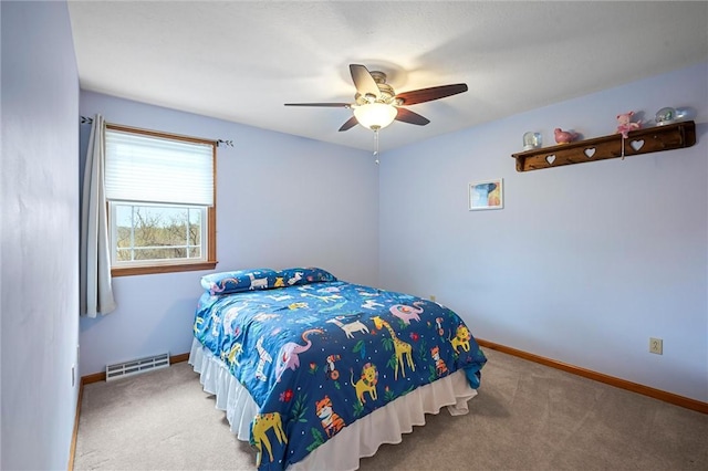 carpeted bedroom with baseboards, visible vents, and ceiling fan