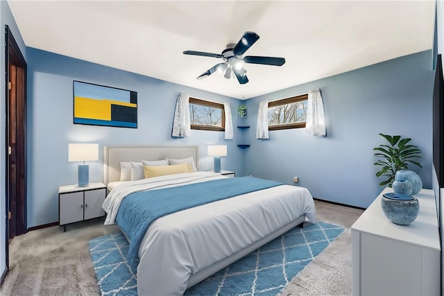 bedroom featuring baseboards, carpet, and a ceiling fan