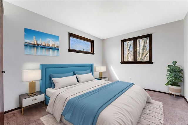 bedroom featuring carpet flooring and baseboards