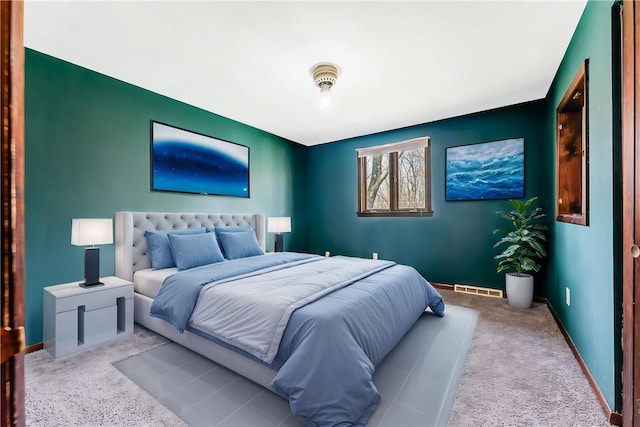 bedroom featuring carpet flooring, baseboards, and visible vents