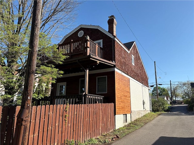 315 Taylor Ave, Bellevue, PA 15202 - view of front of home with a chimney, brick siding, and a balcony