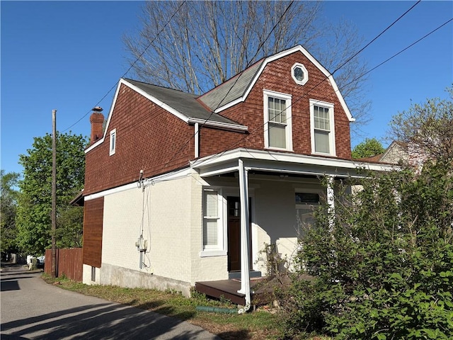 315 Taylor Ave, Bellevue, PA 15202 - exterior space with brick siding, a chimney, and a gambrel roof