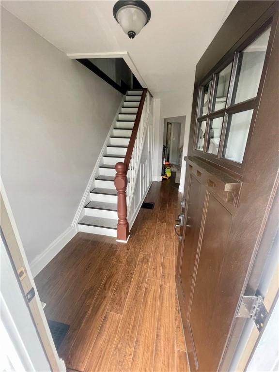315 Taylor Ave, Bellevue, PA 15202 - staircase with baseboards and wood finished floors