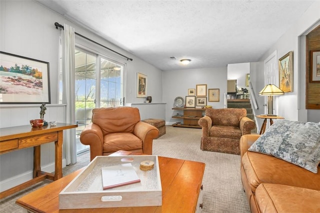 5983 Daleview Dr, Bethel Park, PA 15102 - living area featuring carpet, a textured ceiling, and stairway