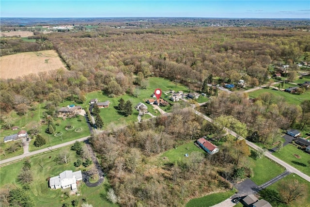 birds eye view of property with a wooded view