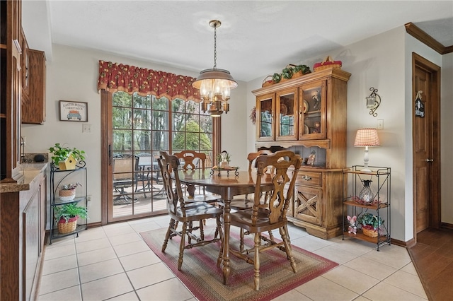 1058 Rimrock Rd, City Of Greensburg, PA 15601 - dining room with an inviting chandelier, baseboards, and light tile patterned floors
