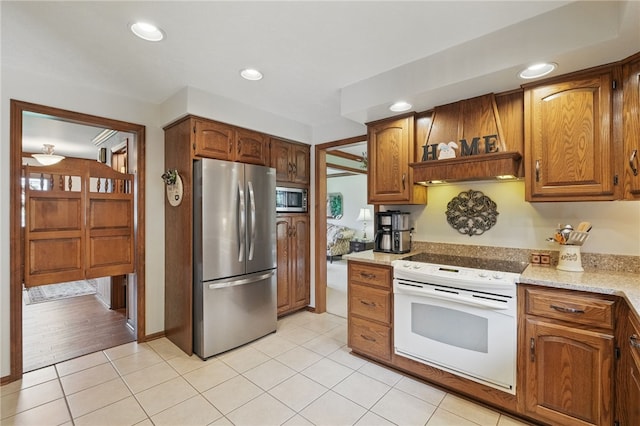 1058 Rimrock Rd, City Of Greensburg, PA 15601 - kitchen with light stone counters, light tile patterned floors, brown cabinets, and stainless steel appliances