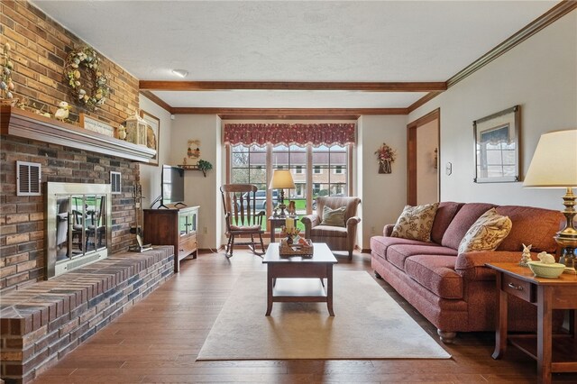 1058 Rimrock Rd, City Of Greensburg, PA 15601 - living area with a fireplace, ornamental molding, wood-type flooring, and visible vents