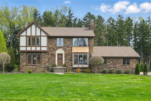 1058 Rimrock Rd, City Of Greensburg, PA 15601 - english style home with a front lawn, roof with shingles, and a chimney