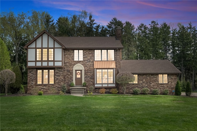 1058 Rimrock Rd, City Of Greensburg, PA 15601 - tudor home with brick siding, a front lawn, and a chimney