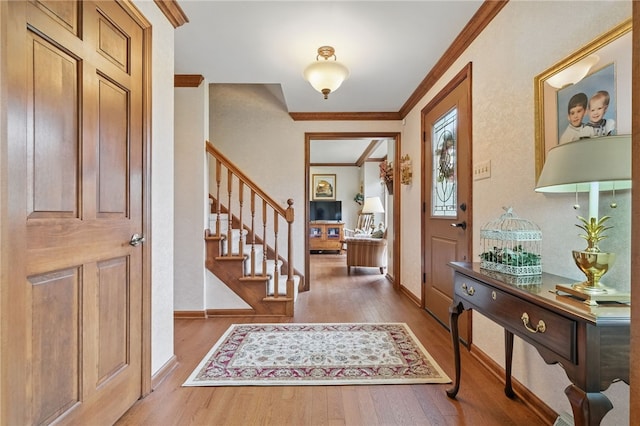 1058 Rimrock Rd, City Of Greensburg, PA 15601 - foyer with crown molding, baseboards, wood finished floors, and stairway
