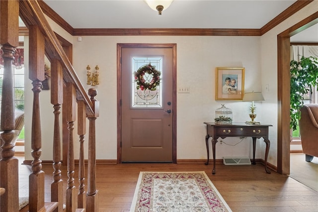 1058 Rimrock Rd, City Of Greensburg, PA 15601 - entrance foyer with a healthy amount of sunlight, ornamental molding, light wood-type flooring, and stairs