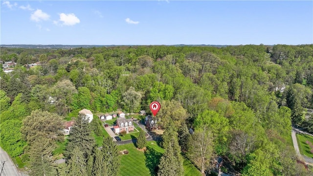 aerial view featuring a wooded view